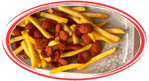 Salchipapa peruana served in a traditional Peruvian style